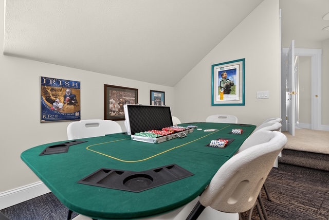 The upstairs game room with a full poker table and Notre Dame memorabilia